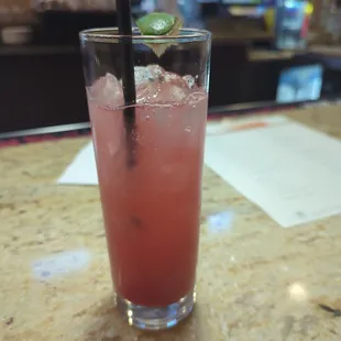 a drink with a lime on top