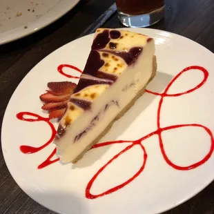 Our yelp free dessert with two entree; blueberry swirl cheesecake with fresh strawberry fan and sauce?