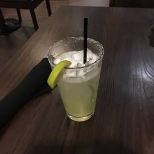a margarita with a lime slice on the rim