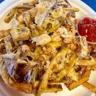 Our amazing Seaside fries with Langostino Lobster, truffle oil and special spice and cheese blend!