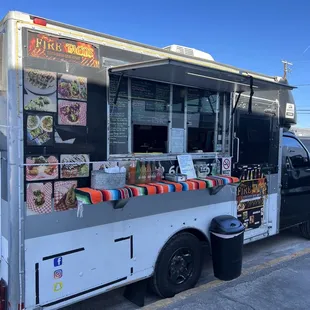 a food truck parked on the side of the road