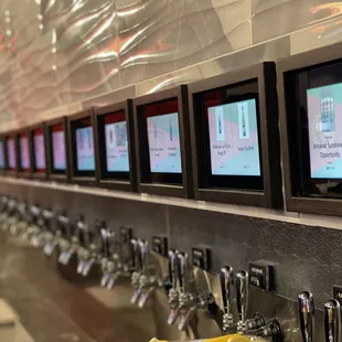 a row of beer taps
