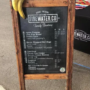 a menu board with a bunch of bananas