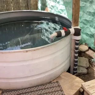 Sunflower room outdoor tub (at least 300 gallons). Clean and dry when you arrive, you just open the red valve to fill it yourself!