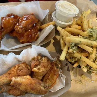 Mango Habanero wings and garlic fries  Lemon pepper wings