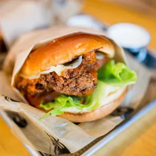 a chicken sandwich with lettuce and tomato