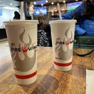 Beverages at the table with views of a few televisions.