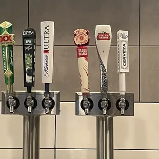 a row of beer taps