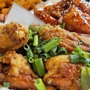 a plate of chicken wings and french fries