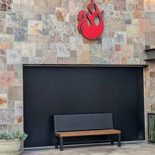 Bench under the Fire Wings logo