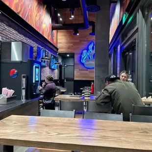 two people sitting at a table in a restaurant