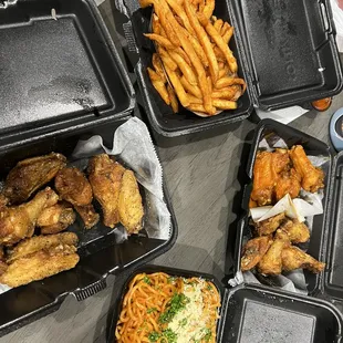 Buffalo, lemon pepper bone-in wings, fries, garlic noodles