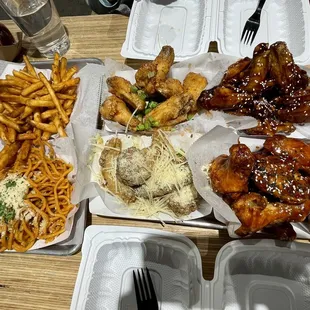 40 piece meal: garlic noodles, seasoned fries, wings (Korean Kick, Garlic Parmesan, Teriyaki, Saigon Street)