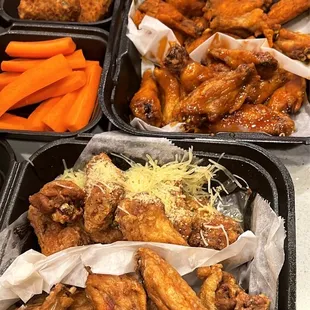 chicken wings and carrots in trays