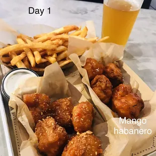 Fusion boneless Peanut butter &amp; Mango habanero seasoned fries. Oh and a cold Elysian beer.