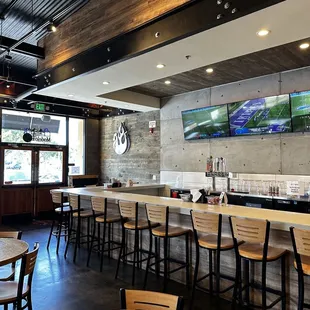 the bar and seating area of a restaurant