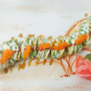 a plate of sushi with a flower