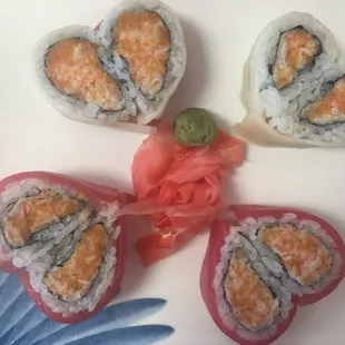 four pieces of sushi on a plate