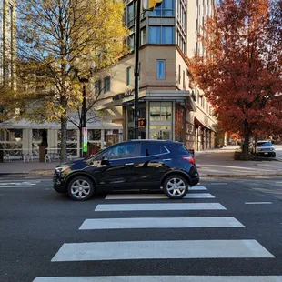 a black car on a city street
