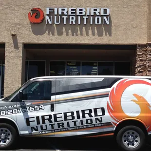 a van parked in front of a building