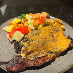 Cajun ribeye and half eaten au gratin