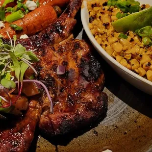 Tomahawk porkchop, carrots, and street corn.