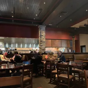 An elegant dining room with viewable kitchen.