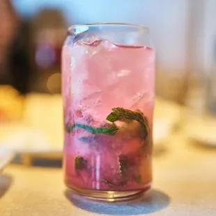 a pink drink in a glass