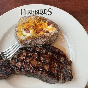 Ribeye and loaded baked potato (minus chives)