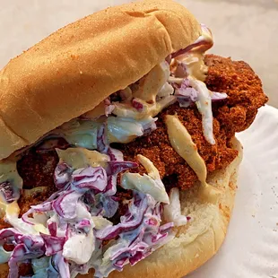 a chicken sandwich with coleslaw