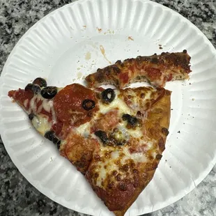 My third slice of pepperoni with black olives. On hand tossed crust.