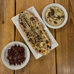 a plate of food and a bowl of dip