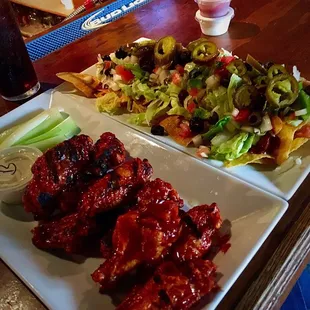 That&apos;s actually a half plate of nachos and the Daytona wings.