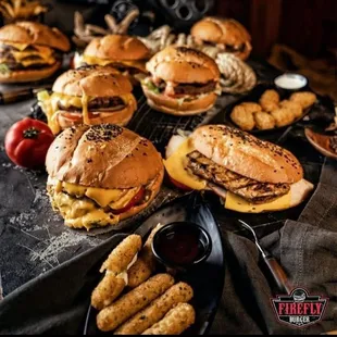 a table full of burgers