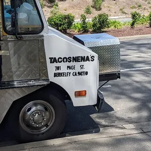 a white truck parked on the side of the road