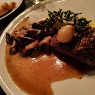 Yukon mash, mushroom ragu, fried oregano &amp; pearl onion demi-glaze