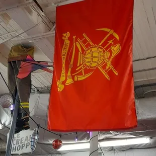 a red flag hanging from the ceiling