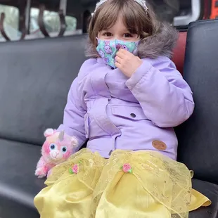 My daughter sitting inside their fire truck, she was dressed up since she came after her birthday party!