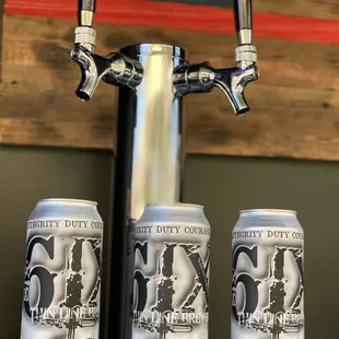 three cans of firehouse cookies