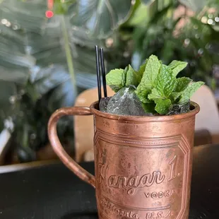 a copper mug filled with mint