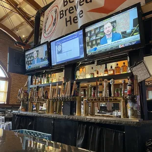 a bar with a large screen tv