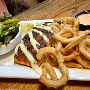 Blackened Salmon with asparagus and onion straws