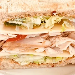 Turkey Avocado Sandwich is piled high with meat, the avocado aioli is delicious