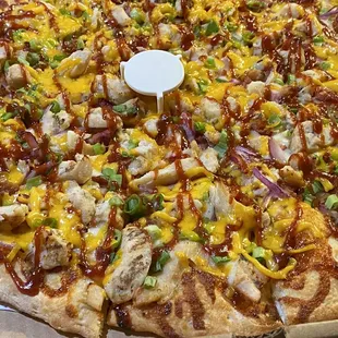BBQ Chicken Pizza... tons of toppings all the way to the edge.