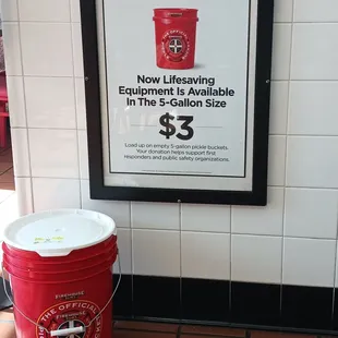 a red bucket and a white bucket