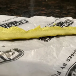 a peeled banana on a paper bag