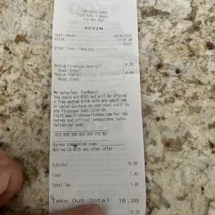 a person holding a receipt