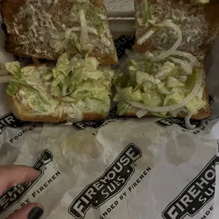 a sandwich with lettuce and cheese