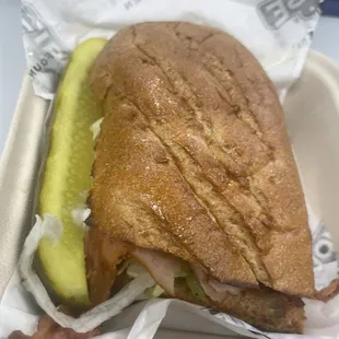 a sandwich in a styrofoam container