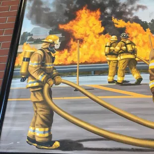 Left side of the large pic on the wall